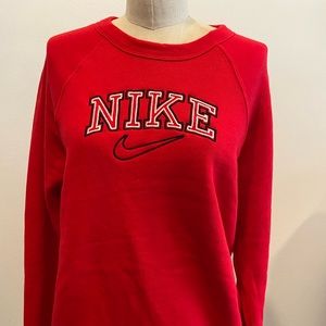Nike embroidered on a red sweatshirt